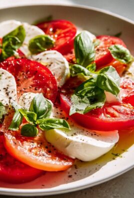 Frischer Tomaten Mozzarella Salat mit Basilikum genießen!
